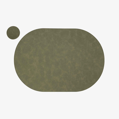 Close-up of the matte vegan-leather surface on a PROMATTOO oval placemat