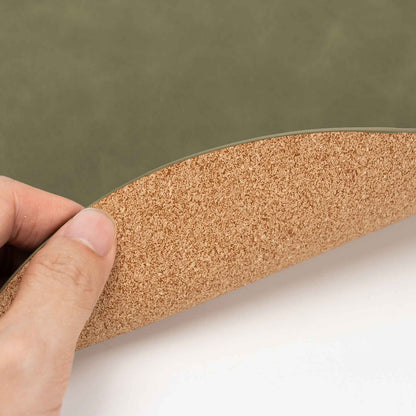 Cork-look printed backing on a PROMATTOO oval faux leather placemat
